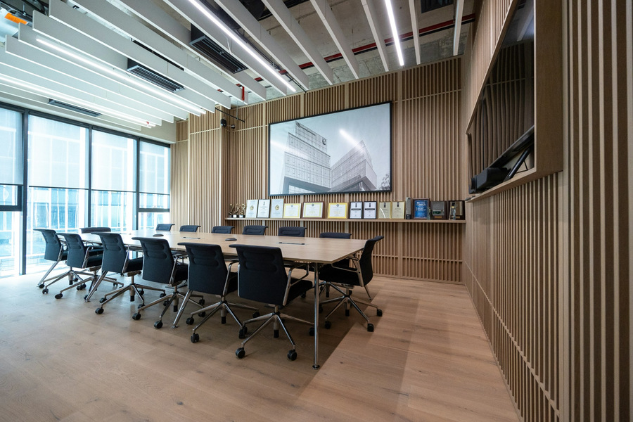 Illustrative executive conference room with wood-slat walls, large windows and a wooden meeting table
